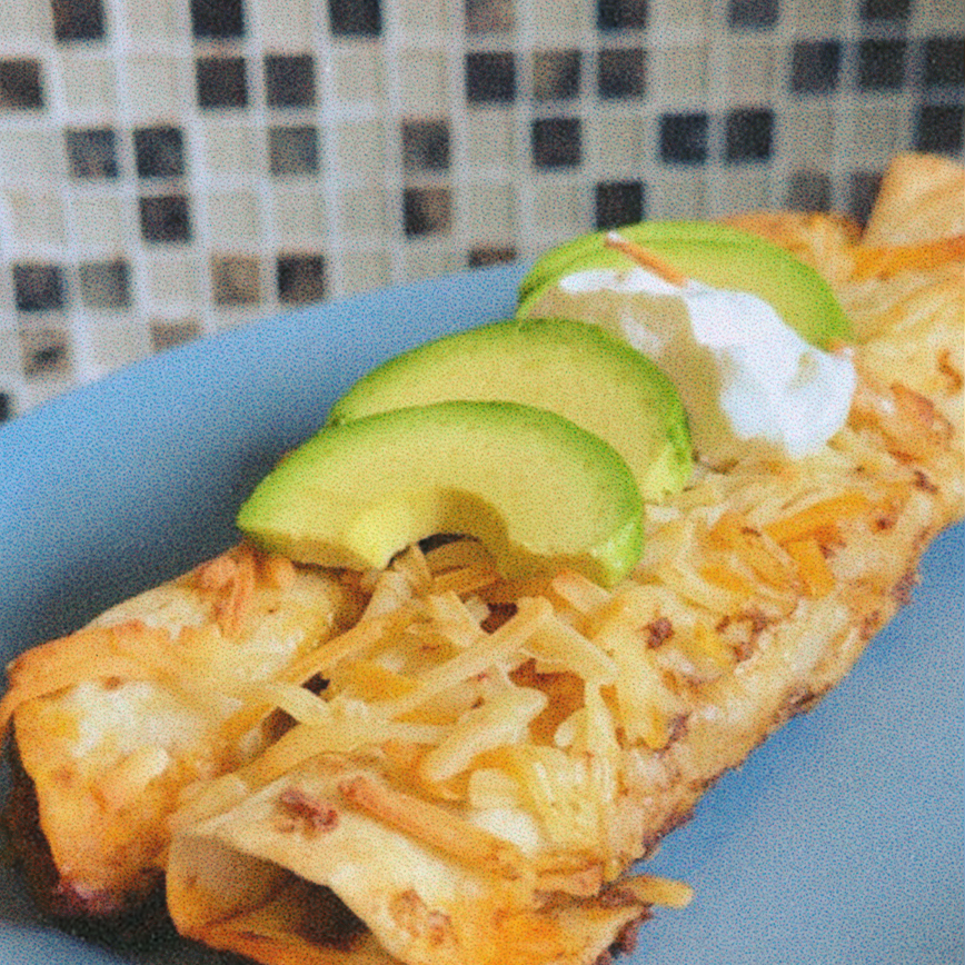 Enchiladas with avocado on top