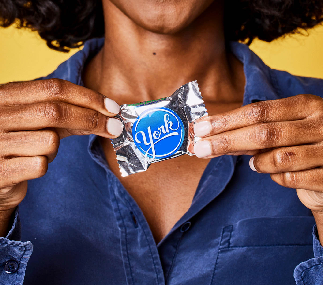 Woman holding York Peppermint Patty